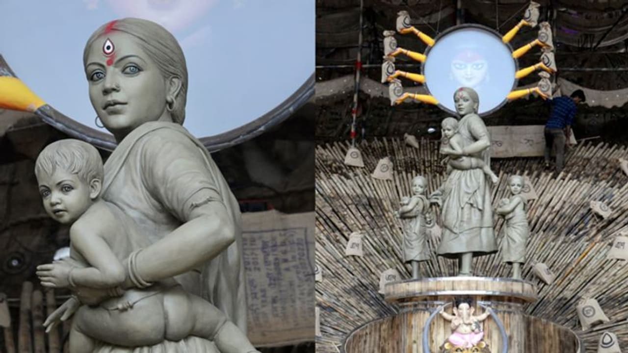 दुर्गा पूजा पंडाल में रखी प्रवासी महिला मजदूर की प्रतिमा, लॉकडाउन के संघर्ष की कहानी कर रही बयां दुर्गा पूजा पंडाल में रखी प्रवासी महिला मजदूर की प्रतिमा, लॉकडाउन के संघर्ष की कहानी कर रही बयां