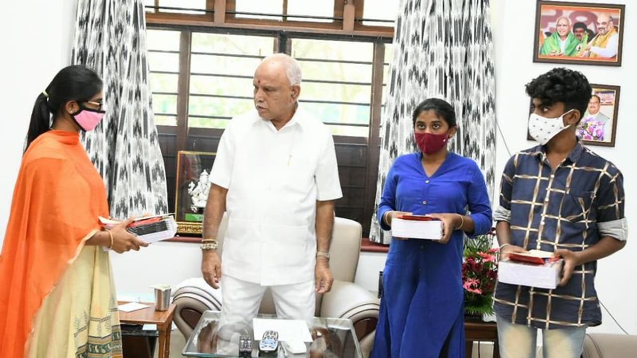 Bengaluru: CM BS Yediyurappa distributes textbooks to children who lost books to the rains