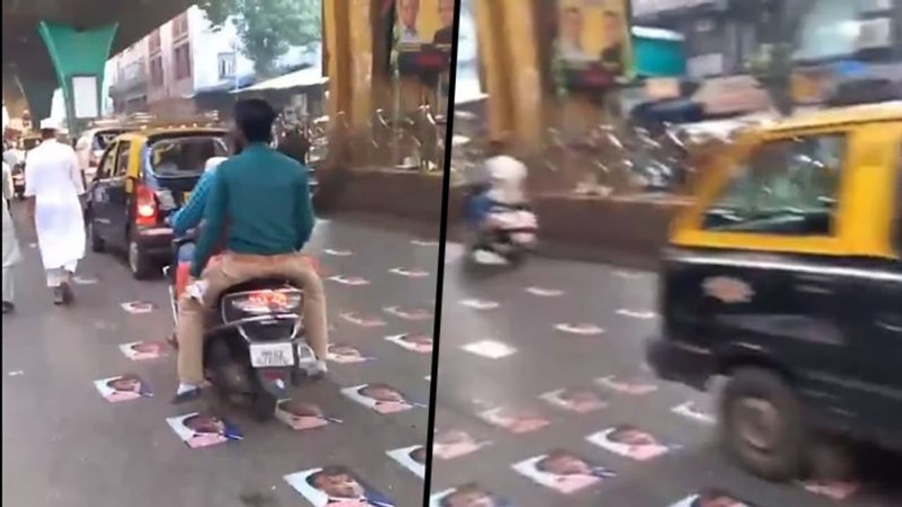 Emmanuel Macron's posters pasted on street in Mumbai as mark of protest, video goes viral Emmanuel Macron's posters pasted on street in Mumbai as mark of protest, video goes viral