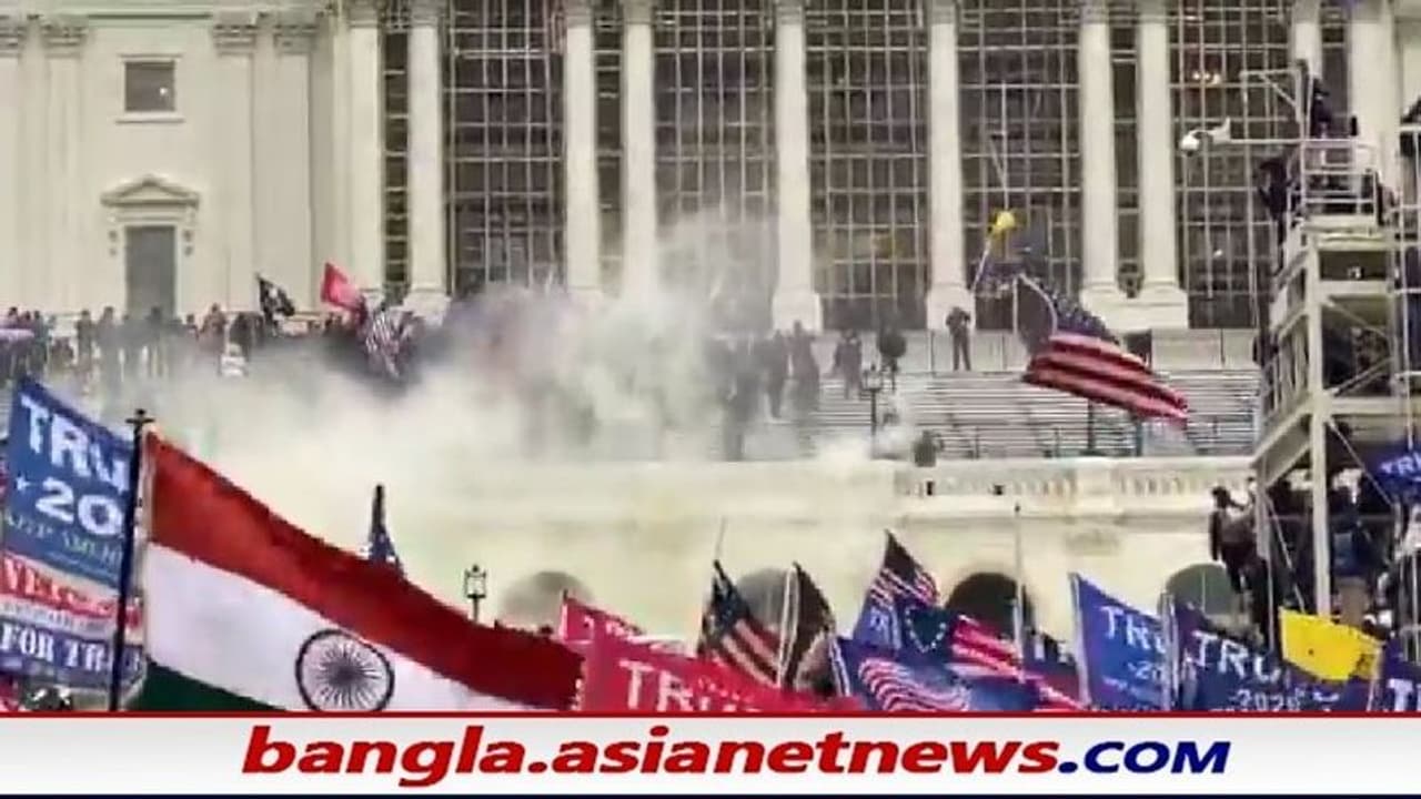 ট্রাম্প সমর্থকদের দাঙ্গায় উড়ল ভারতীয় তেরঙ্গা পতাকা, কে ওই রহস্যময় ব্যক্তি ট্রাম্প সমর্থকদের দাঙ্গায় উড়ল ভারতীয় তেরঙ্গা পতাকা, কে ওই রহস্যময় ব্যক্তি