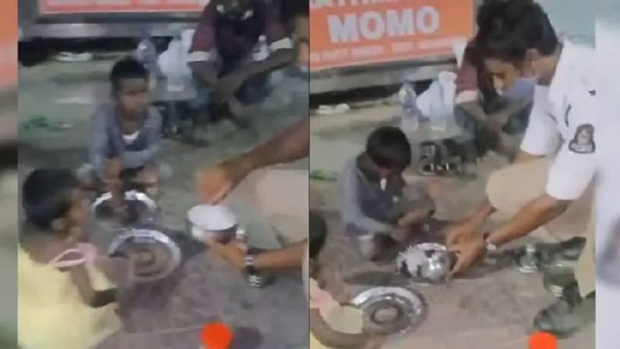 'ആരും വിശന്നുകഴിയേണ്ട'; തെരുവിലെ കുട്ടികള്‍ക്ക് തന്‍റെ ഭക്ഷണം നല്‍കുന്ന പൊലീസ് ഉദ്യോഗസ്ഥന്‍; വൈറലായി വീഡിയോ