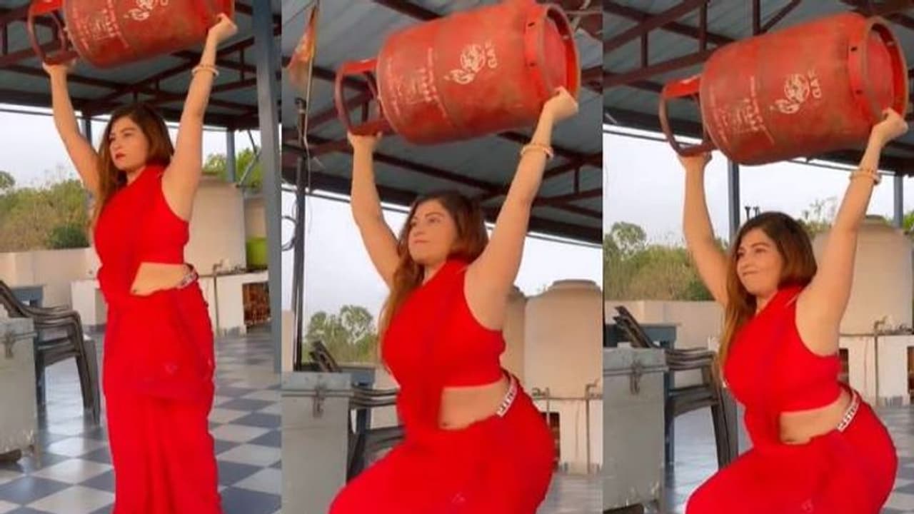 ഗ്യാസ് സിലിണ്ടർ പൊക്കി പിടിച്ച് 'സ്‌ക്വാട്ട്സ്' ചെയ്യുന്ന യുവതി; വര്‍ക്കൗട്ട് വീഡിയോ വൈറല്‍