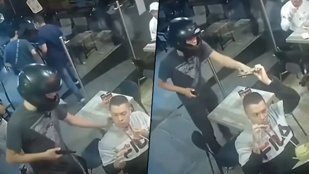 Man Quietly Eats Chicken Wings During Armed Thief Robs Restaurant; Watch Viral Video Man Quietly Eats Chicken Wings During Armed Thief Robs Restaurant; Watch Viral Video