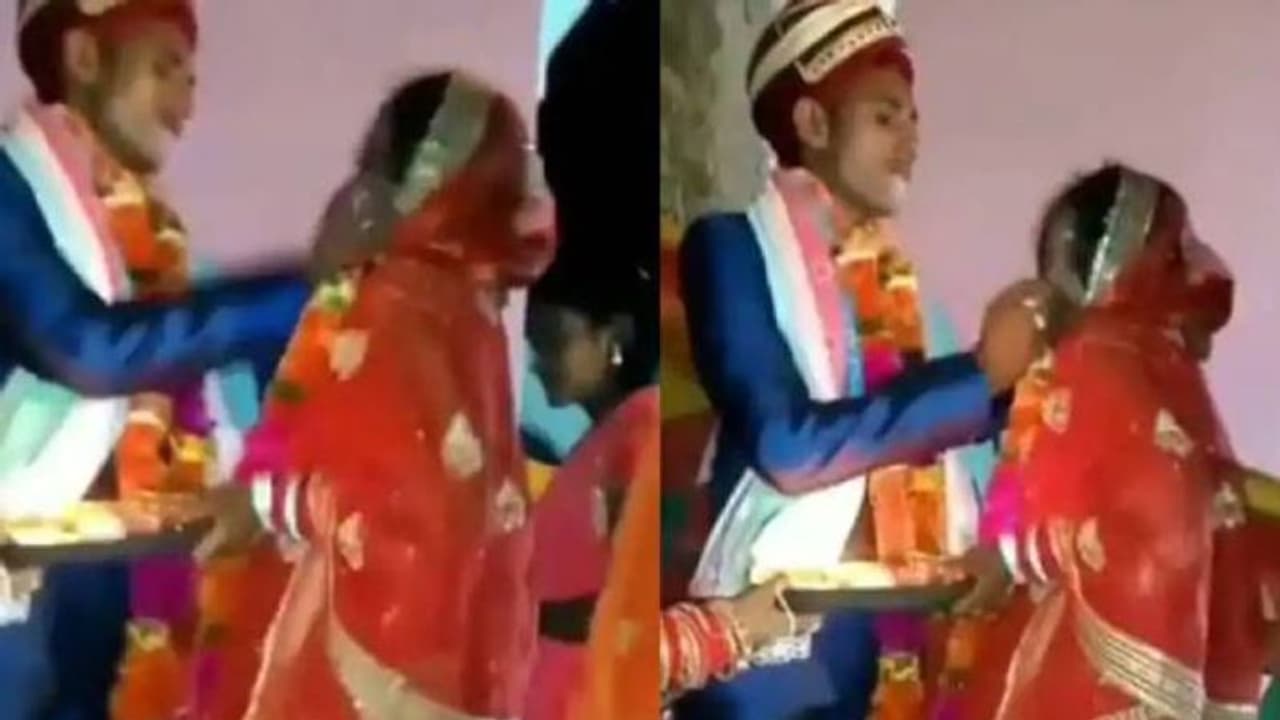 വധുവിന് നിർബന്ധിച്ച് മധുരം നൽകി വരൻ, ധാർഷ്ട്യം നിറഞ്ഞ പെരുമാറ്റത്തെ ചോദ്യം ചെയ്ത് സോഷ്യൽമീഡിയ