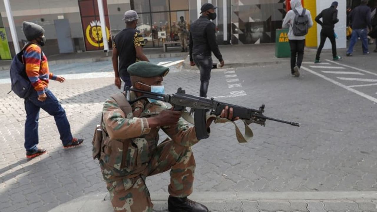 Violence hit South Africa assures India on safety of Indian community Violence hit South Africa assures India on safety of Indian community