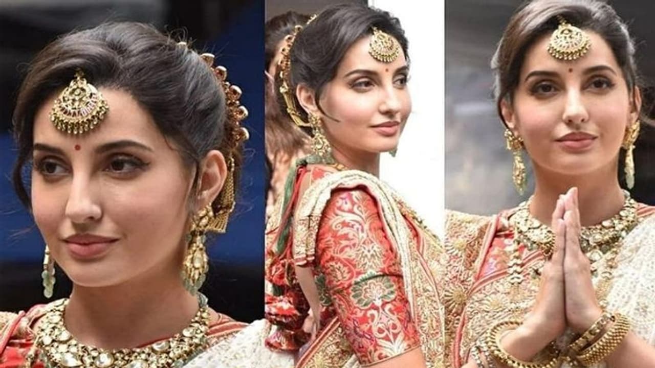 লাল পাড় সাদা শাড়ি, ওয়েস্টার্ন নয় সম্পূর্ণ বাঙালি লুকেই নেটিজেনদের অবাক করে দিলেন নোরা লাল পাড় সাদা শাড়ি, ওয়েস্টার্ন নয় সম্পূর্ণ বাঙালি লুকেই নেটিজেনদের অবাক করে দিলেন নোরা