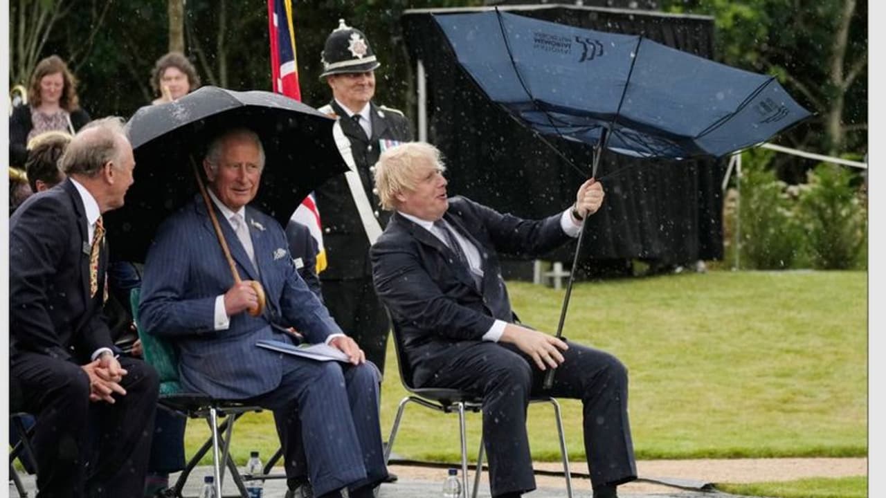 Boris Johnson struggles with his umbrella during event in England; Watch viral clip Boris Johnson struggles with his umbrella during event in England; Watch viral clip