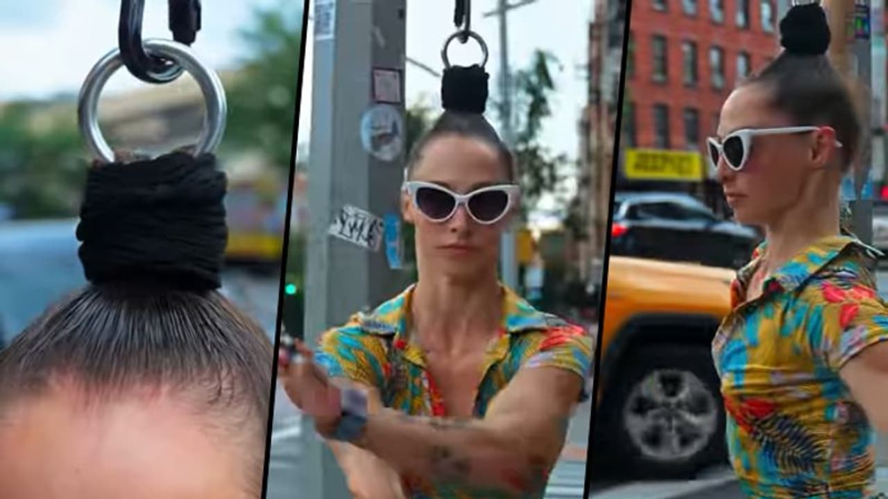 Aerialist performer hangs by her hair; unbelievable video goes viral Aerialist performer hangs by her hair; unbelievable video goes viral