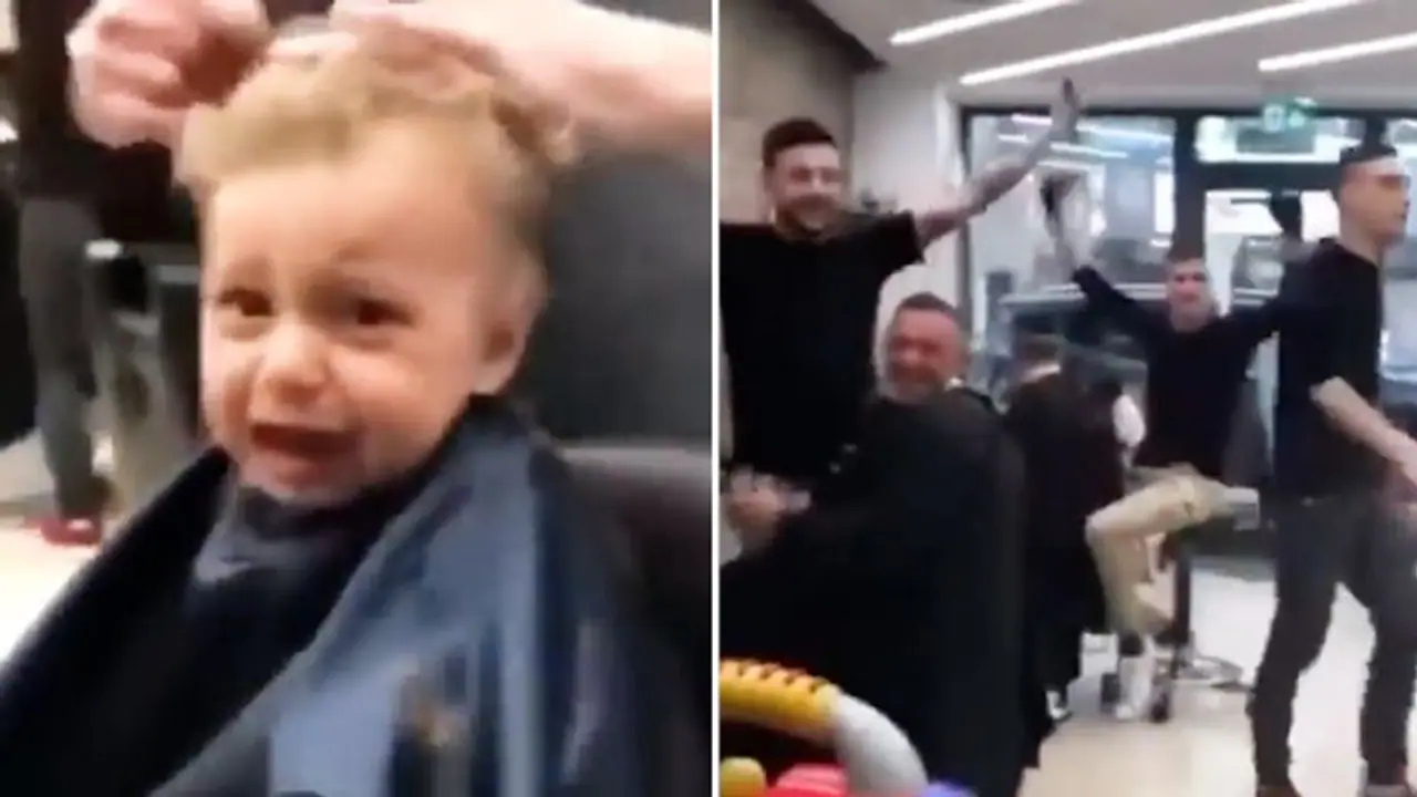Barbers sing together to calm down little kid on his first haircut; wins hearts