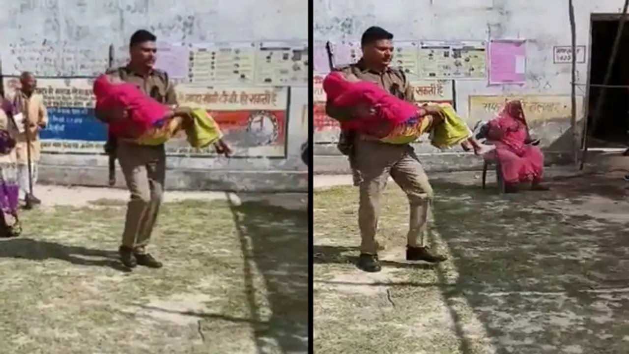 कांधे पर बंदूक और गोद में माँ! यूपी में इस तरह बूढ़ी महिला को गोद में उठाकर पोलिंग बूथ तक लेकर आया पुलिस जवान