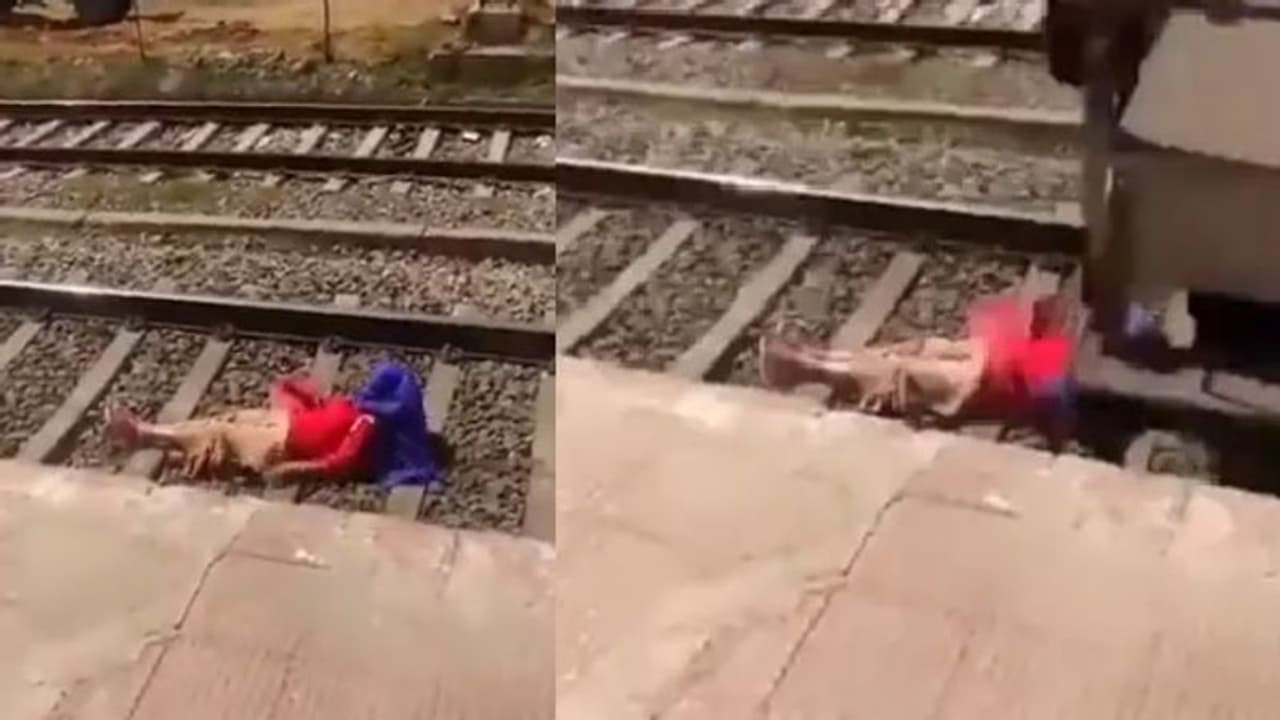 ரயில் தண்டவாளத்தில் படுத்துக்கொண்டு பெண் செய்த காரியம்… இணையத்தில் தீயாய் பரவும் வைரல் வீடியோ!! ரயில் தண்டவாளத்தில் படுத்துக்கொண்டு பெண் செய்த காரியம்… இணையத்தில் தீயாய் பரவும் வைரல் வீடியோ!!