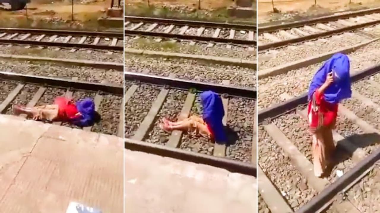 Watch: Woman talks on phone as train passes over her; netizens outraged