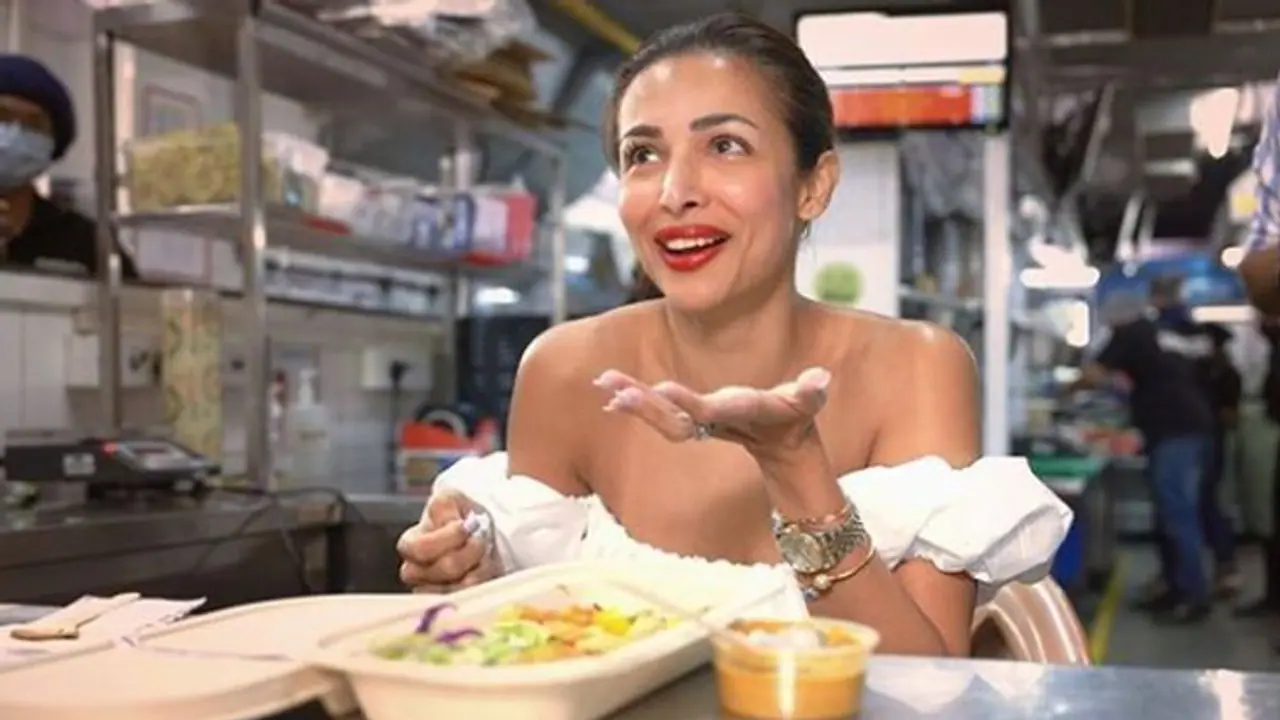 Malaika Arora looks cute as she dons chef’s hat in a white off shoulder top