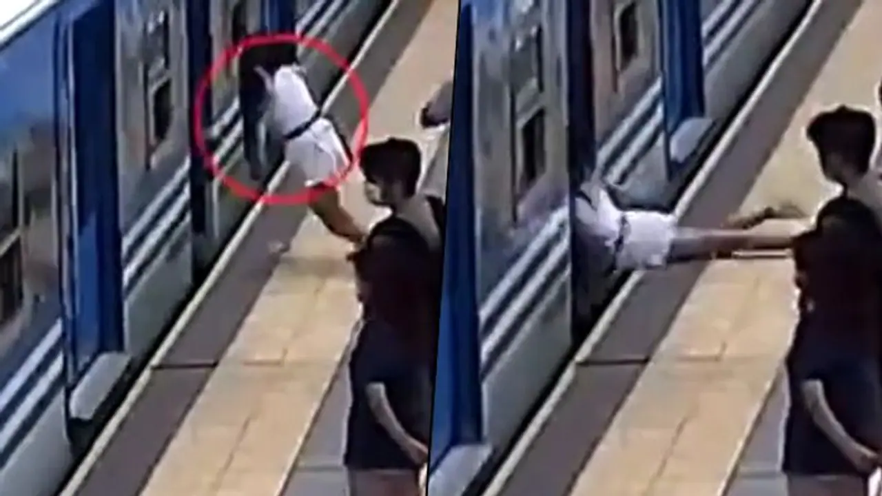 Spine chilling video shows a woman fainting and falling under a train; watch Spine chilling video shows a woman fainting and falling under a train; watch