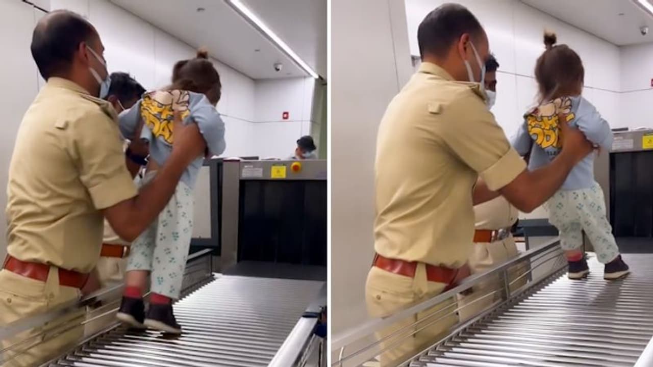 Watch: CISF personnel playing with a kid at Delhi airport; netizens love it