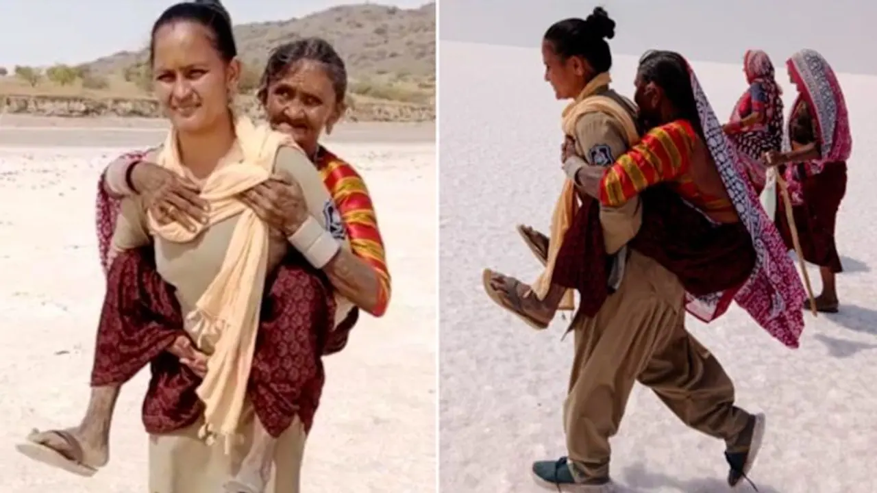 Woman cop carries elderly woman on shoulders for 5 kms in Kutch desert; wins netizens’ hearts Woman cop carries elderly woman on shoulders for 5 kms in Kutch desert; wins netizens’ hearts