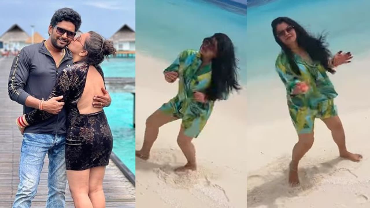 हनीमून पर भोजपुरी फिल्मों की लूलिया निधि झा ने किया पति Kiss, समुंदर किनारे बीच पर नाचती आई नजर