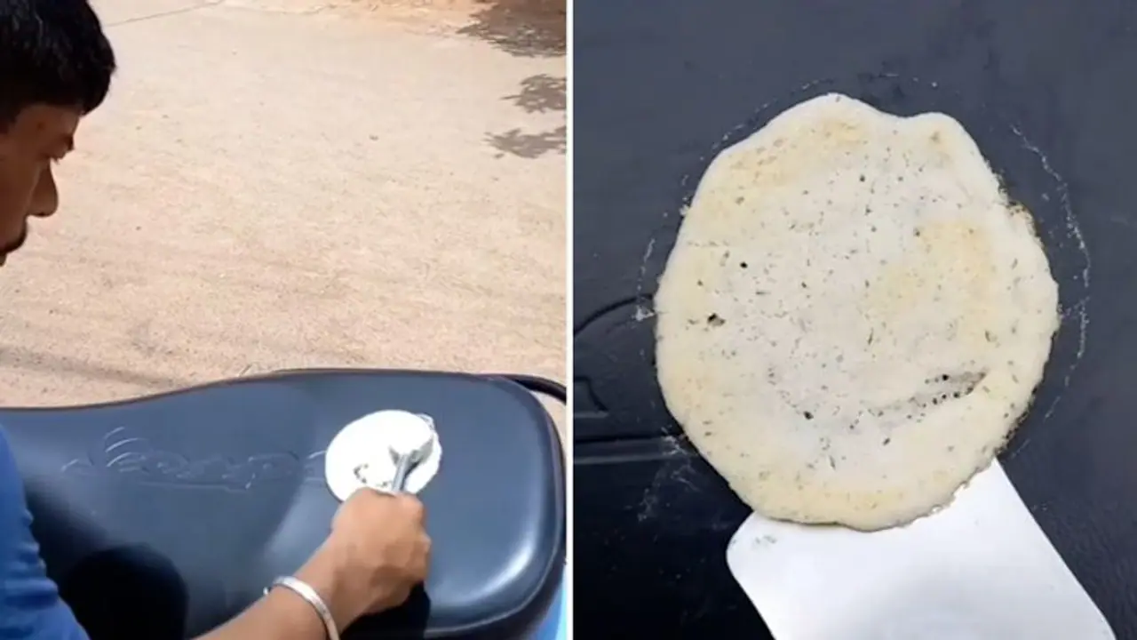 After roti, omelette, scorching heat helps man cook dosa on scooter; Watch After roti, omelette, scorching heat helps man cook dosa on scooter; Watch