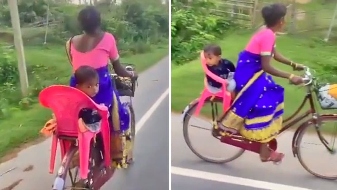 मां ने बच्चे को साइकिल पर बिठाने के लिए लगाया गजब जुगाड़, इंटरनेट पर मिल रही तारीफ, देखिए वायरल वीडियो मां ने बच्चे को साइकिल पर बिठाने के लिए लगाया गजब जुगाड़, इंटरनेट पर मिल रही तारीफ, देखिए वायरल वीडियो