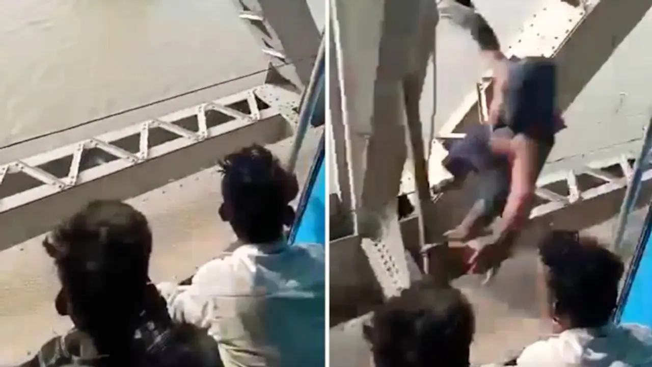 Spider Man thief? Man snatches passenger's phone from a moving train in Bihar; Watch clip Spider Man thief? Man snatches passenger's phone from a moving train in Bihar; Watch clip