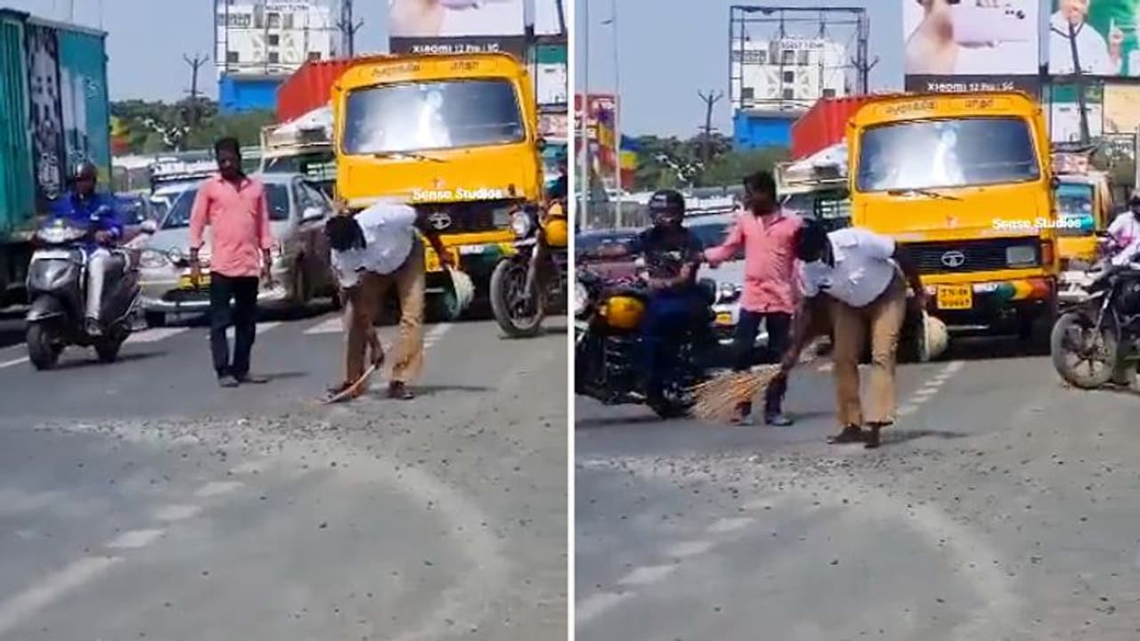 Watch: Traffic cops sweep away trap rocks from road for commuters Watch: Traffic cops sweep away trap rocks from road for commuters