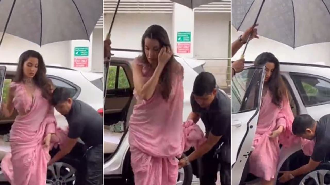 गार्ड ने भीगते हुए संभाली नोरा फतेही की साड़ी तो गुस्साए लोग बोले ये कहीं की महारानी है गार्ड ने भीगते हुए संभाली नोरा फतेही की साड़ी तो गुस्साए लोग बोले ये कहीं की महारानी है