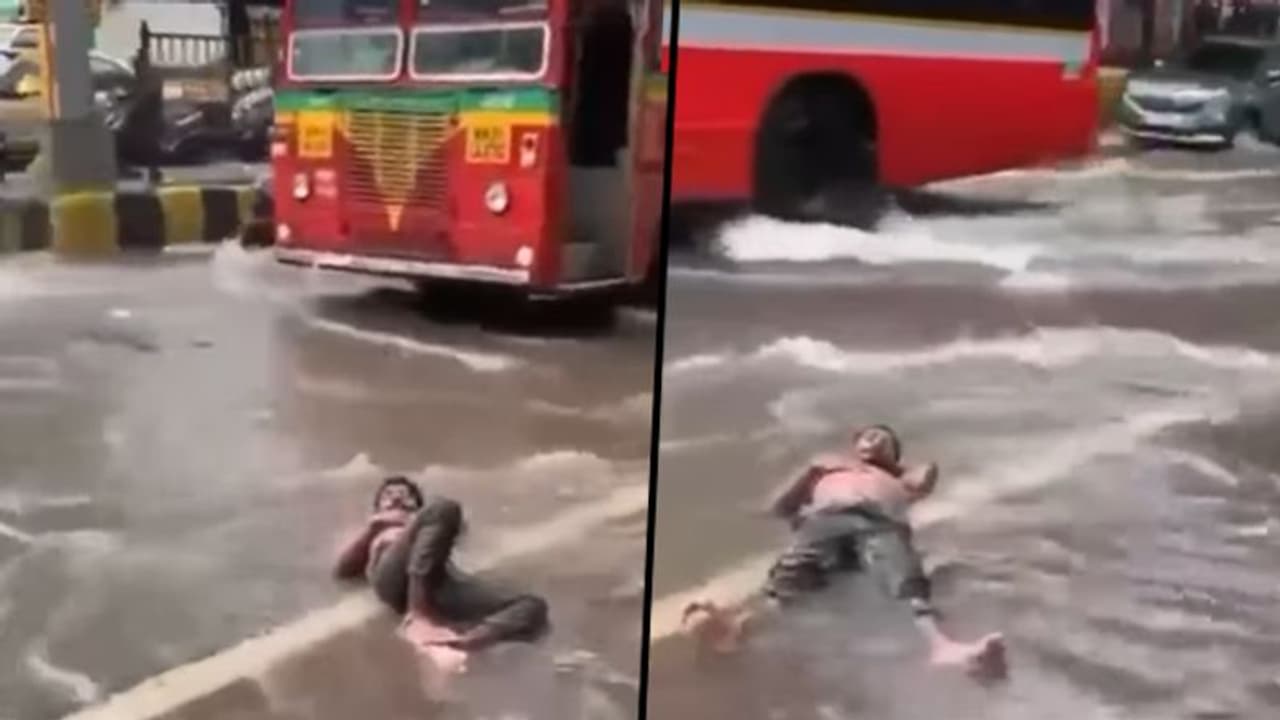 Man lies on waterlogged Mumbai road: Social media compares 'Malad' with Maldives