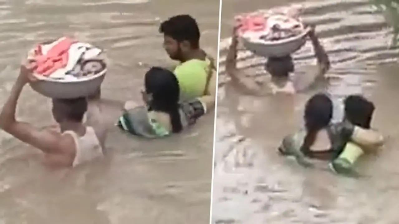 Watch: Man carries infant on head in a tub; reminds of Baahubali’s iconic scene Watch: Man carries infant on head in a tub; reminds of Baahubali’s iconic scene