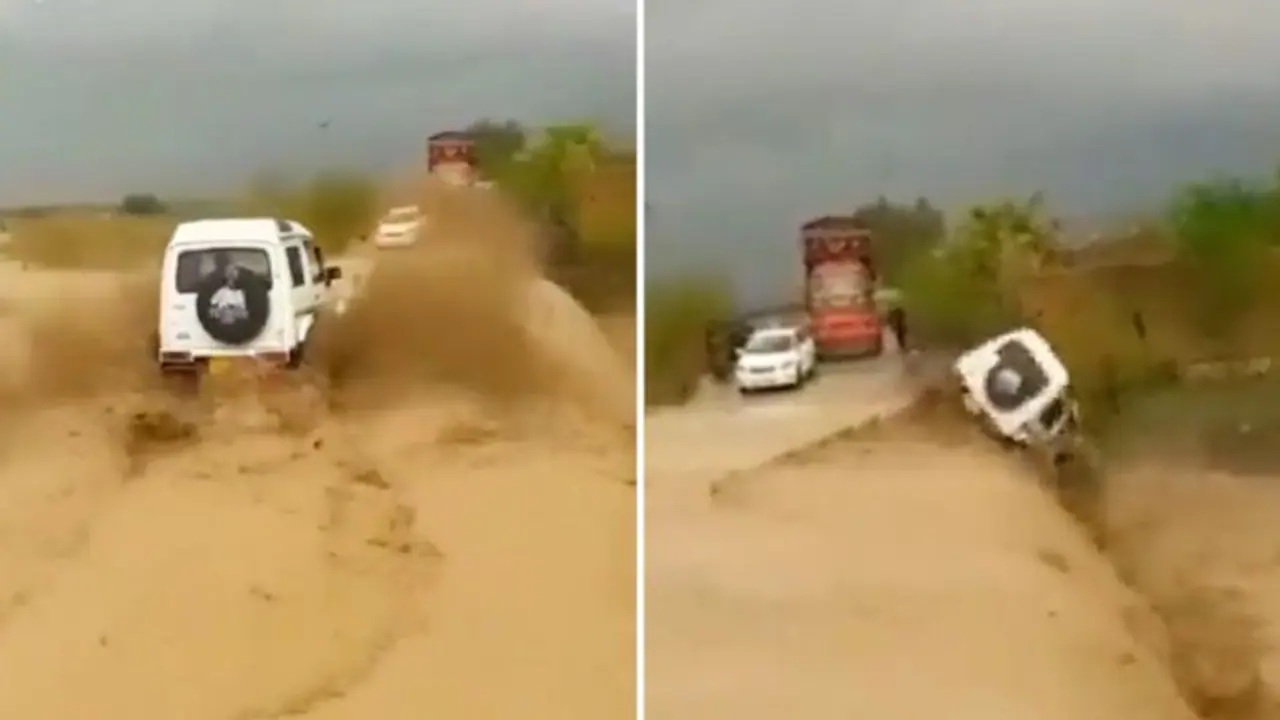 Watch: Car plunges into ditch after driver speeds on flooded road