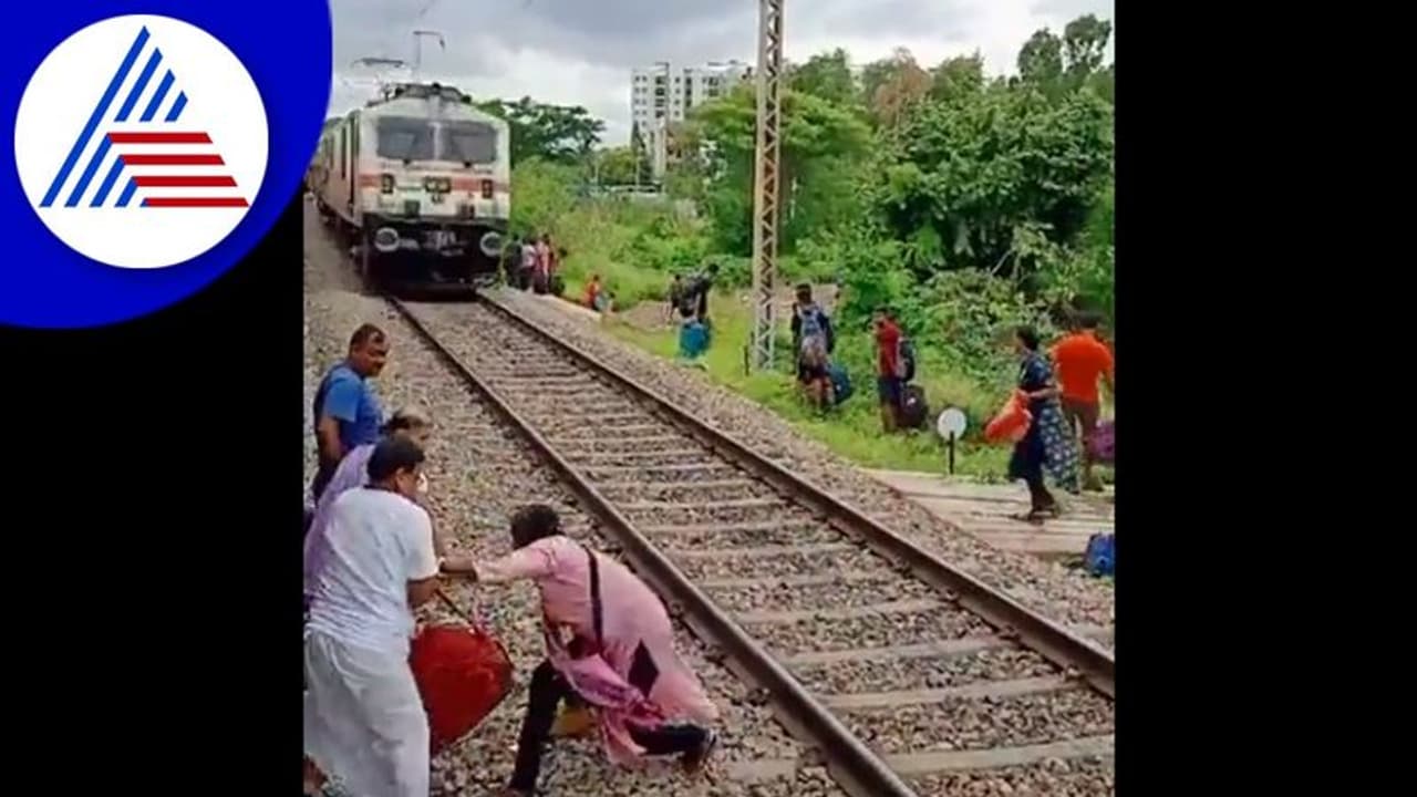 ಲಗೇಜ್ ಹಿಡಿದು ಹಳಿ ದಾಟಿದ ಮಹಿಳೆ, ರೈಲು ಬಂದರೂ ಪವಾಡ ಸದೃಶ ರೀತಿ ಬಚಾವ್!