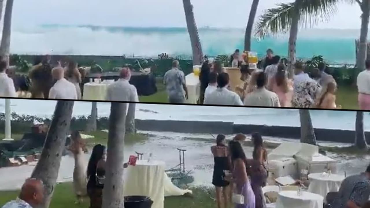 Viral video: Giant waves crash into shore, wedding party disrupted