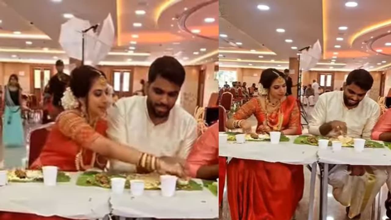 दूल्हा दुल्हन खाना खाते वक्त एक दूसरे से ऐसे उलझे, Video देख बोलेंगे How cute