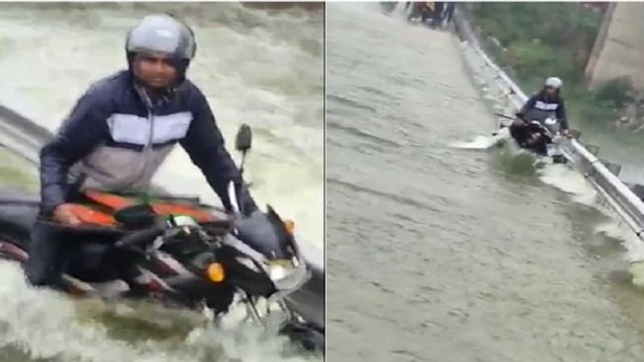 వరదల్లో కొట్టుకుపోతున్న వ్యక్తిని.. చాకచక్యంగా కాపాడిన పోలీసులు...(వీడియో) వరదల్లో కొట్టుకుపోతున్న వ్యక్తిని.. చాకచక్యంగా కాపాడిన పోలీసులు...(వీడియో)