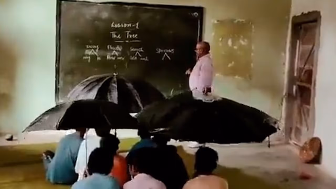 Watch: MP students sit with umbrellas inside classroom due to leaking roof 
