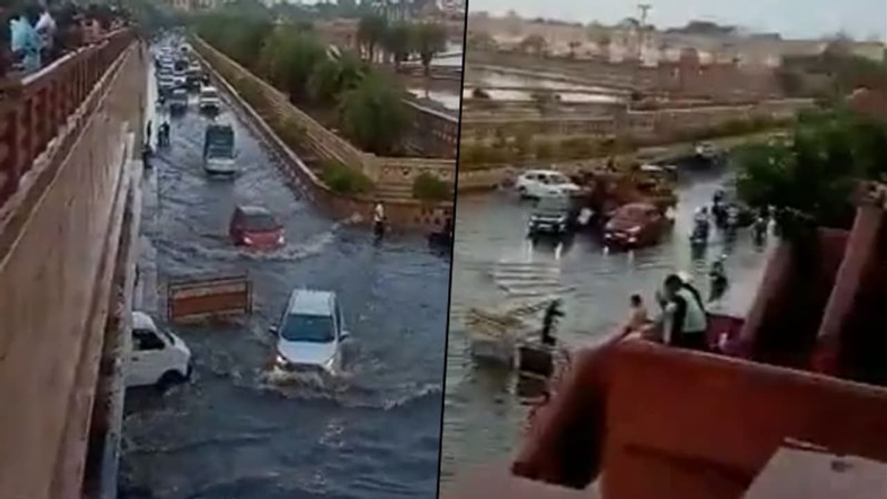 Heavy rain forces cars to drive through flooded streets in Lucknow; Watch
