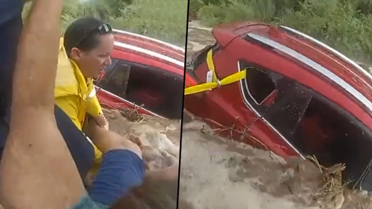 Cops save woman trapped in car amid rising flood waters: watch video Cops save woman trapped in car amid rising flood waters: watch video
