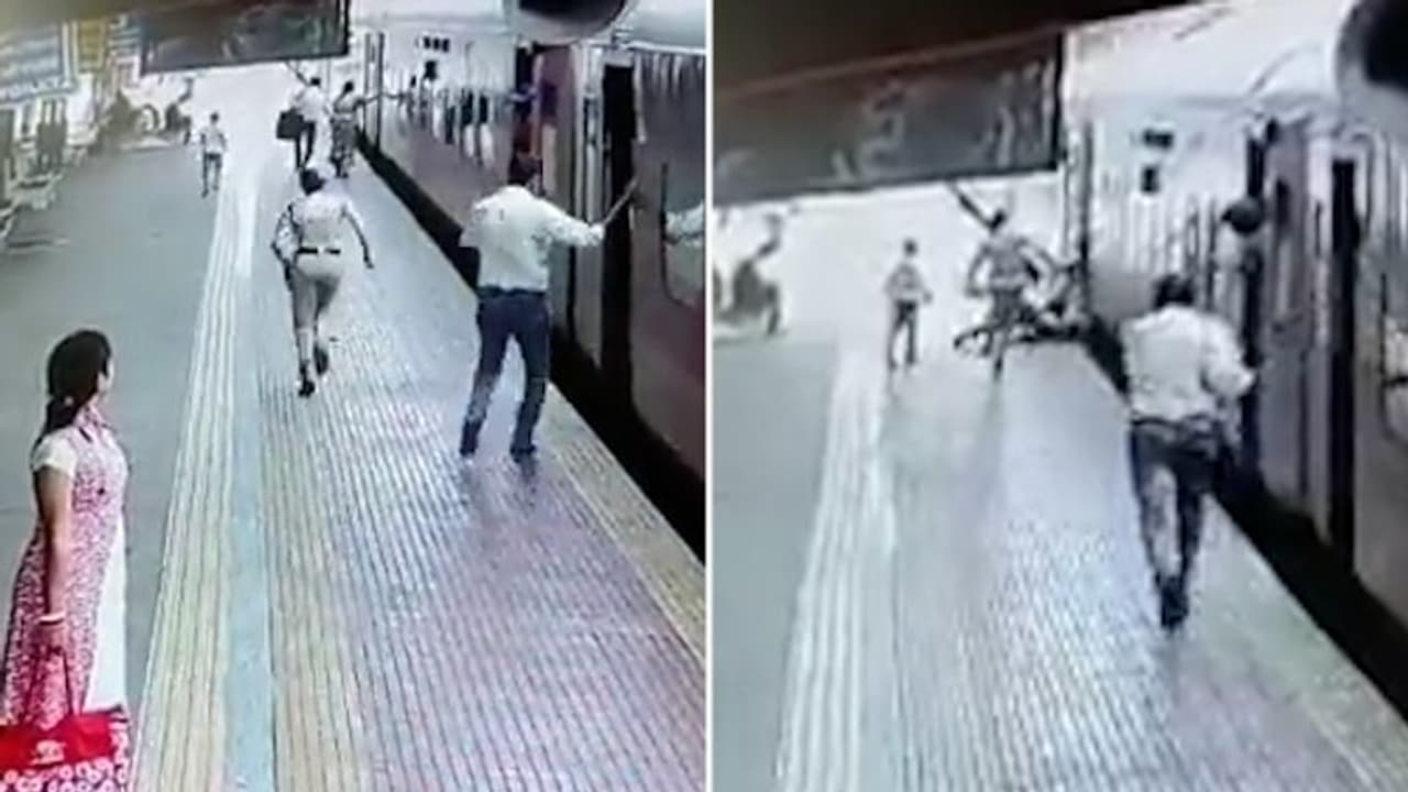 Watch: Railway police's quick action saves an older woman and son who slipped while boarding the train Watch: Railway police's quick action saves an older woman and son who slipped while boarding the train
