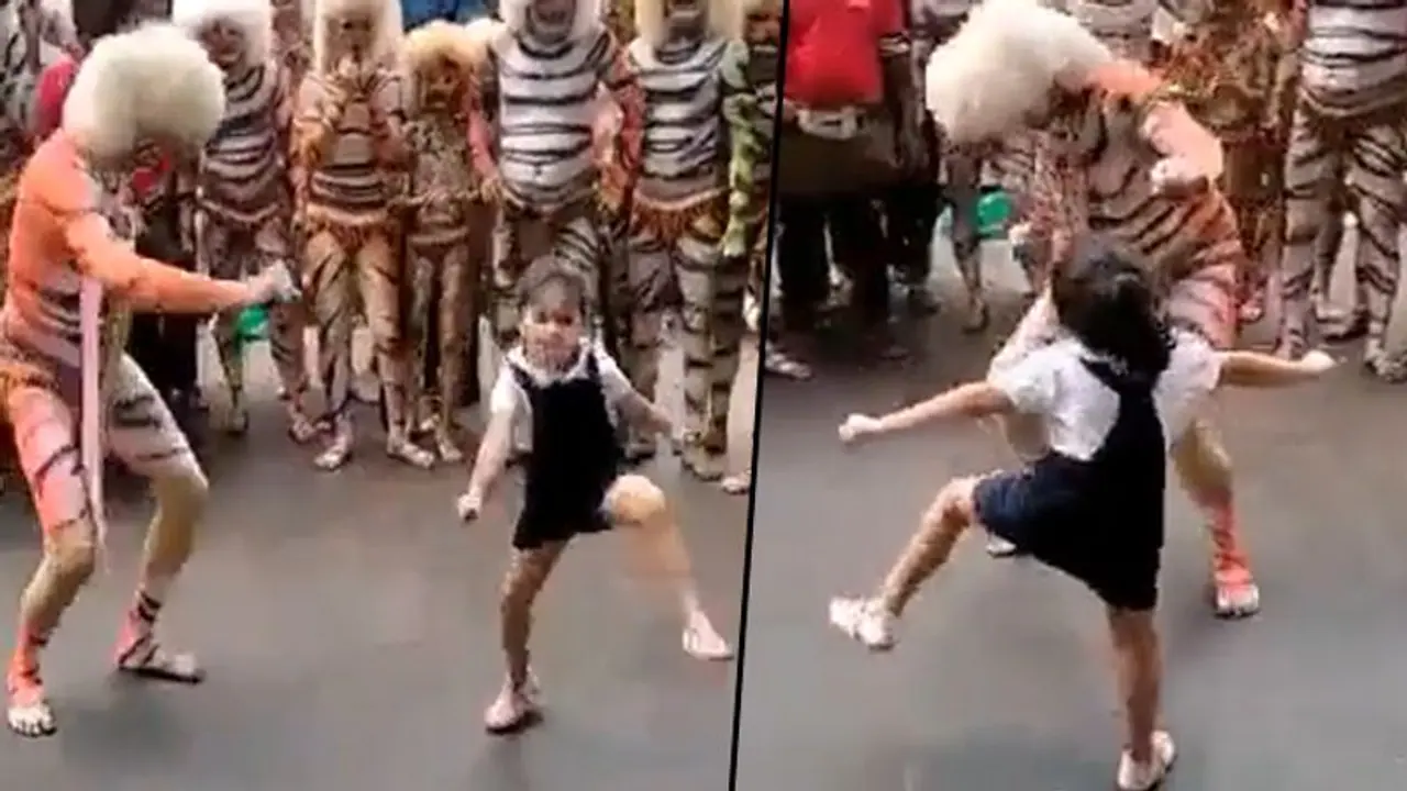 Little girl unites folk dancer during a public performance; heartwarming video goes viral Little girl unites folk dancer during a public performance; heartwarming video goes viral