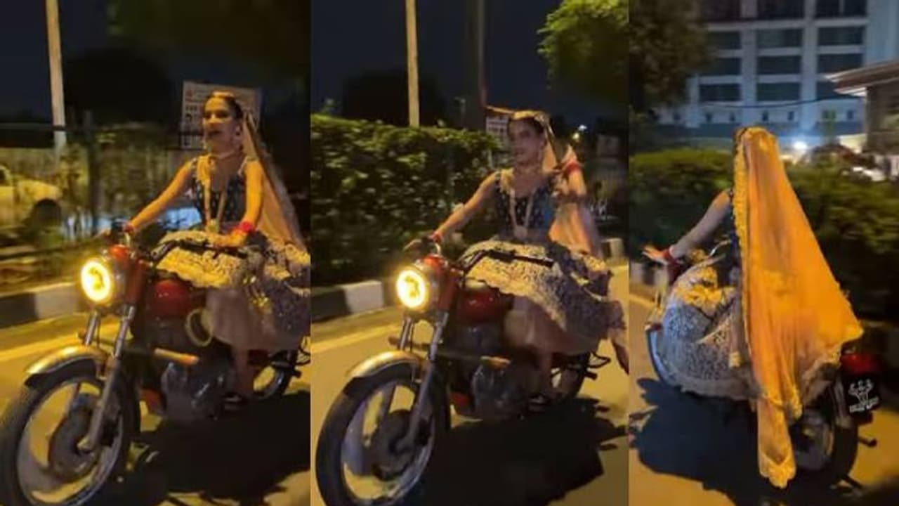 കല്യാണ വേദിയിലേക്ക് ബുള്ളറ്റോടിച്ച് വധുവിന്റെ മാസ് എൻട്രി, വീഡിയോ വൈറൽ കല്യാണ വേദിയിലേക്ക് ബുള്ളറ്റോടിച്ച് വധുവിന്റെ മാസ് എൻട്രി, വീഡിയോ വൈറൽ