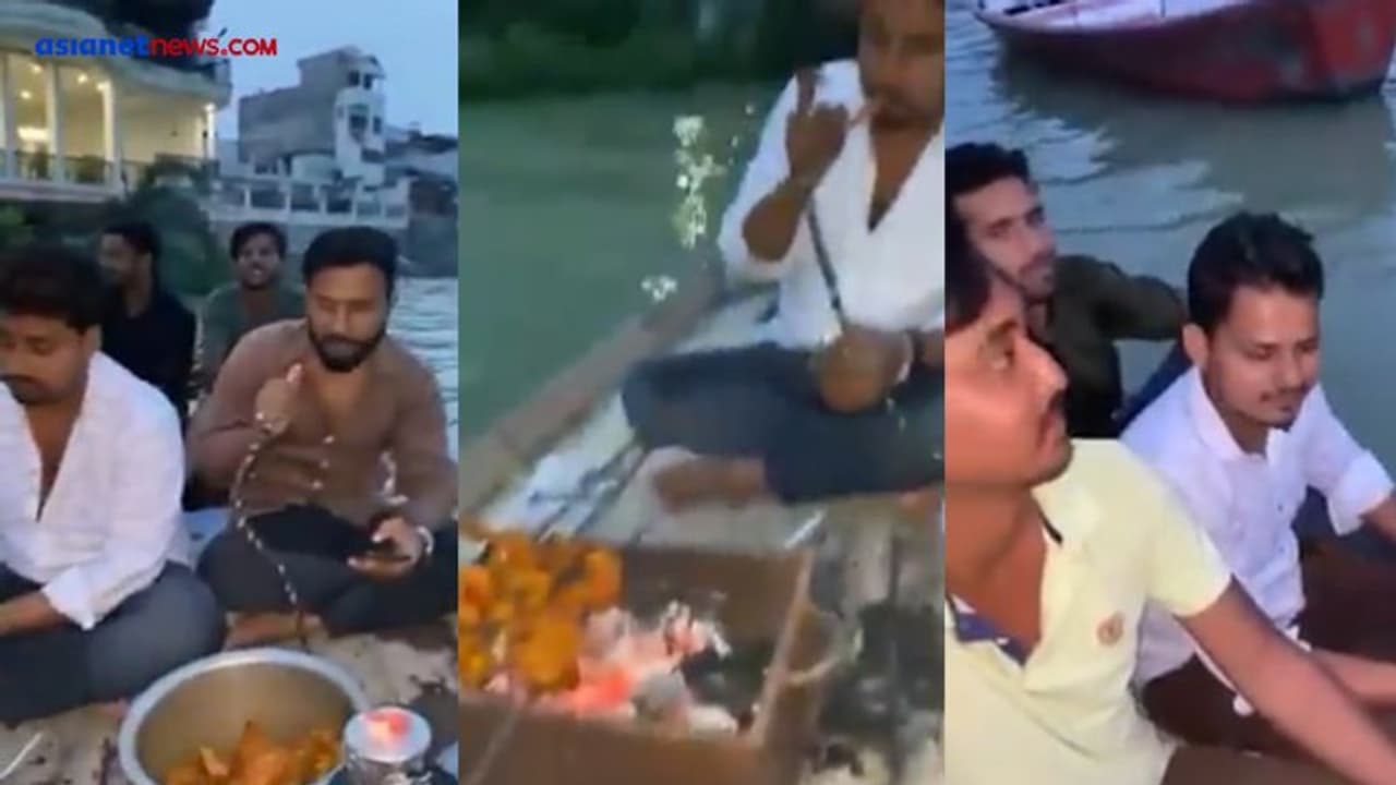 प्रयागराज में उफनती गंगा नदी में नाव पर बैठ हुक्का पीते चिकन खाते युवक, Video से मचा हड़कंप 