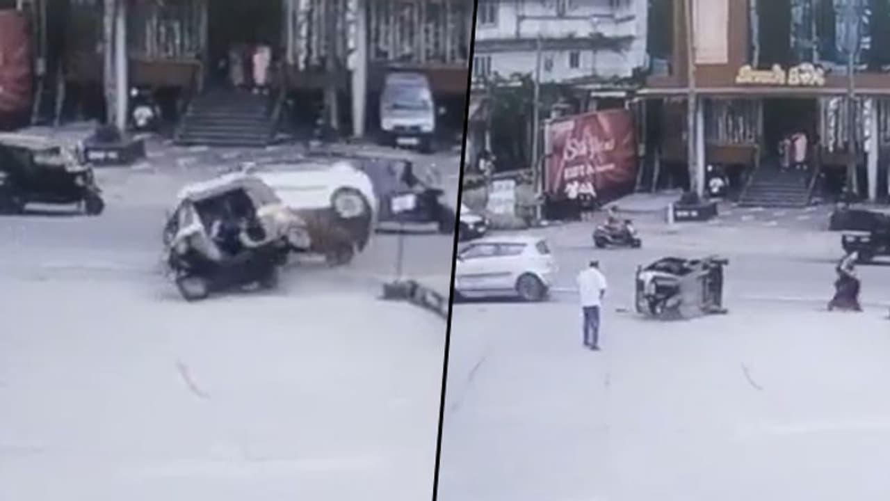 Viral video: Woman narrowly escapes as car rams over an autorickshaw Viral video: Woman narrowly escapes as car rams over an autorickshaw
