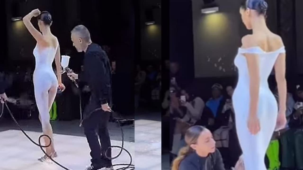 നഗ്നയായി വേദിയിലേയ്ക്ക് ബെല്ല ഹഡീഡ്, സ്പ്രേ ചെയ്ത് വസ്ത്രം; വീഡിയോ വൈറല്‍