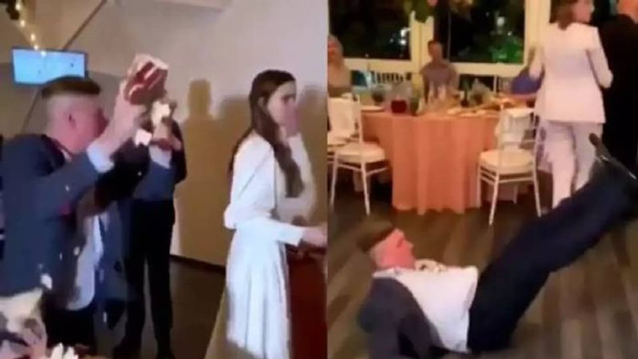 വിവാഹാഘോഷത്തിനിടെ കേക്ക് നശിപ്പിച്ച് അതിഥി, മുഖത്ത് ഇടിച്ച് വരൻ, വീഡിയോ വൈറൽ വിവാഹാഘോഷത്തിനിടെ കേക്ക് നശിപ്പിച്ച് അതിഥി, മുഖത്ത് ഇടിച്ച് വരൻ, വീഡിയോ വൈറൽ
