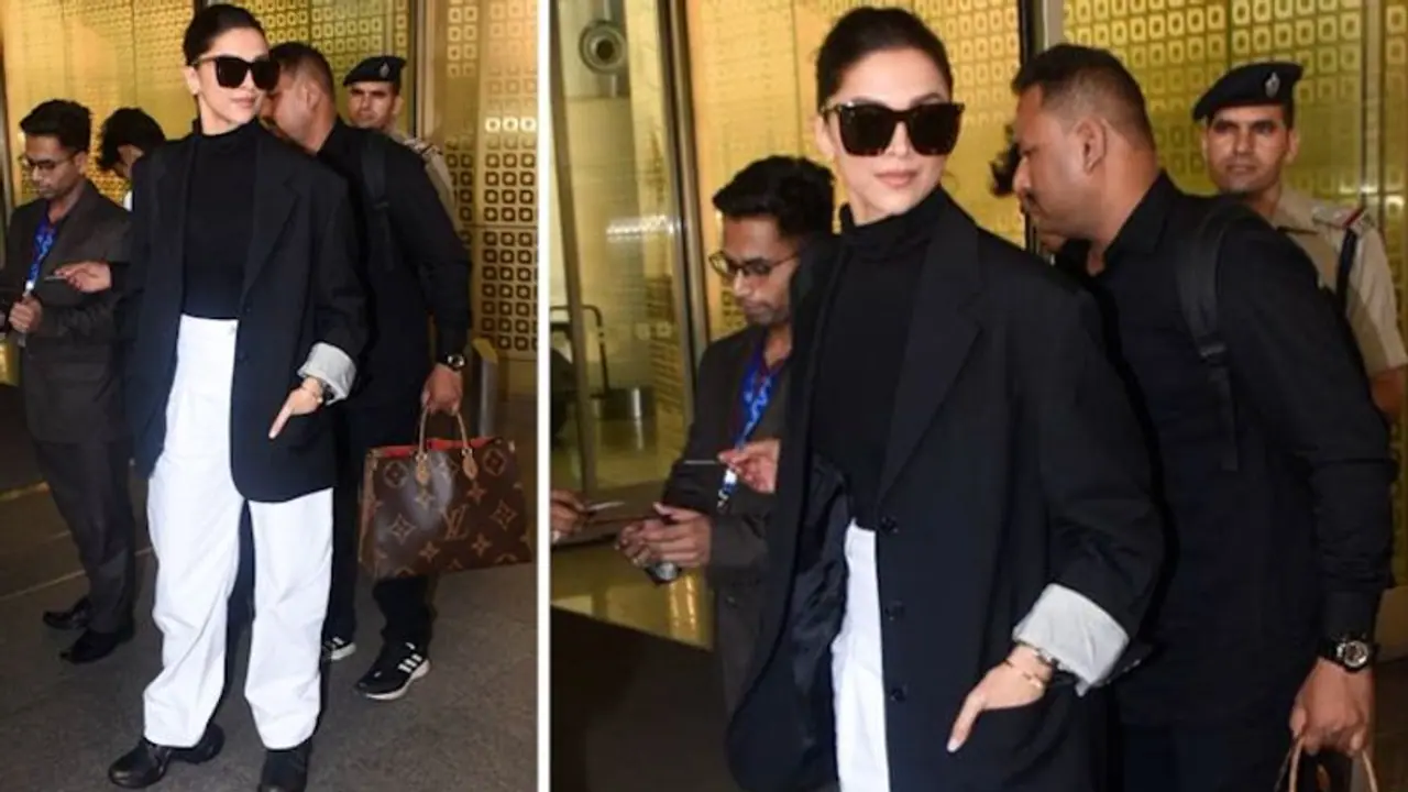 Deepika Padukone's airport look on point as she carries her infectious smile poses for cameras Deepika Padukone's airport look on point as she carries her infectious smile poses for cameras