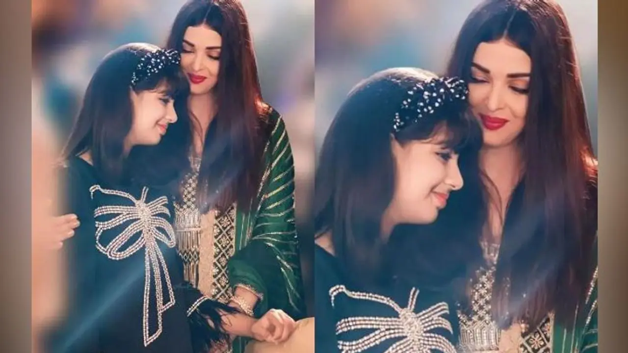 Aaradhya Bachchan birthday video: Aishwarya, Abhishek kisses their 11 year old daughter as she cuts the cake Aaradhya Bachchan birthday video: Aishwarya, Abhishek kisses their 11 year old daughter as she cuts the cake