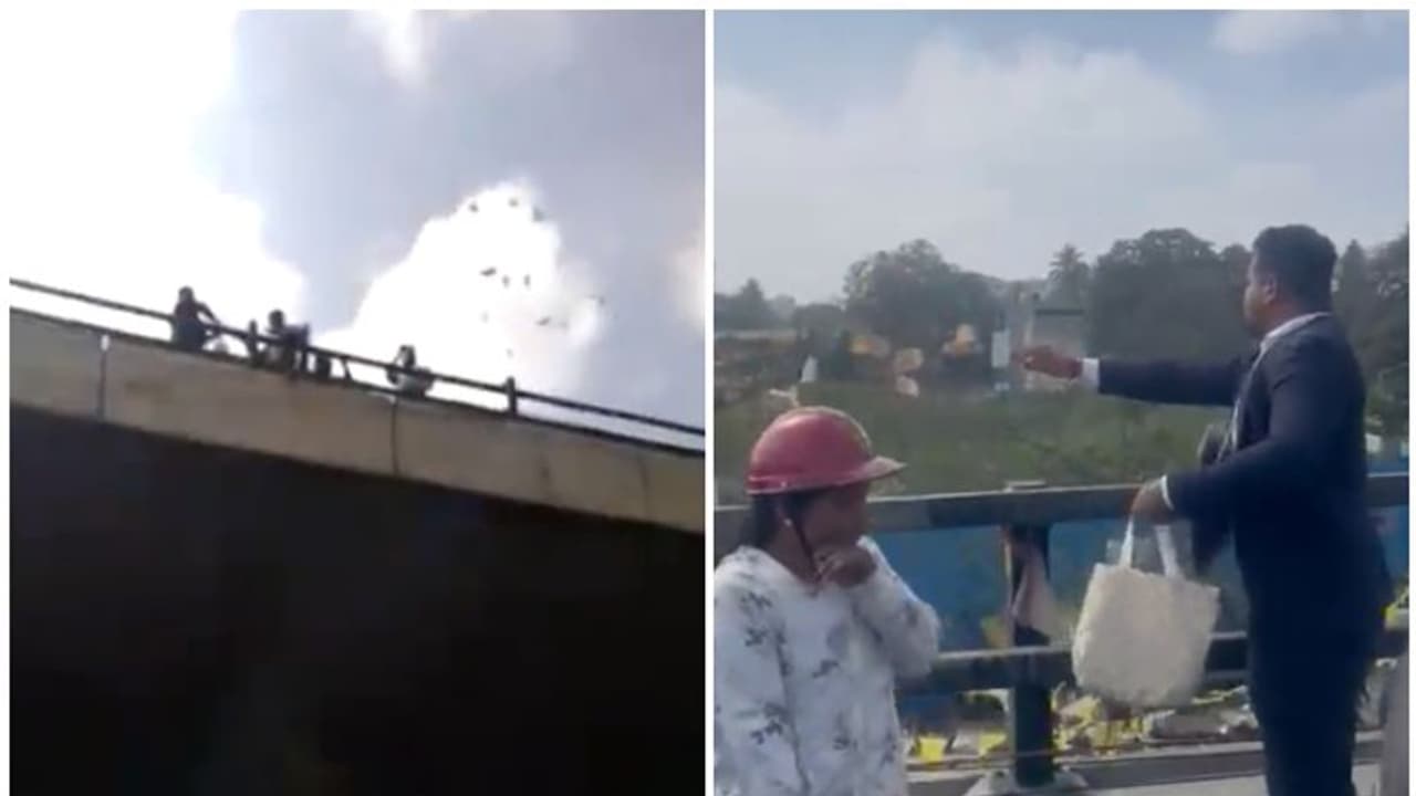 തിരക്കുള്ള നഗരം, മേല്പ്പാലത്തിൽ നിന്ന് നോട്ടുകള് വാരിയെറിഞ്ഞ് യുവാവ്; പെറുക്കി കൂട്ടാൻ വൻ ജനക്കൂട്ടം! തിരക്കുള്ള നഗരം, മേല്പ്പാലത്തിൽ നിന്ന് നോട്ടുകള് വാരിയെറിഞ്ഞ് യുവാവ്; പെറുക്കി കൂട്ടാൻ വൻ ജനക്കൂട്ടം!