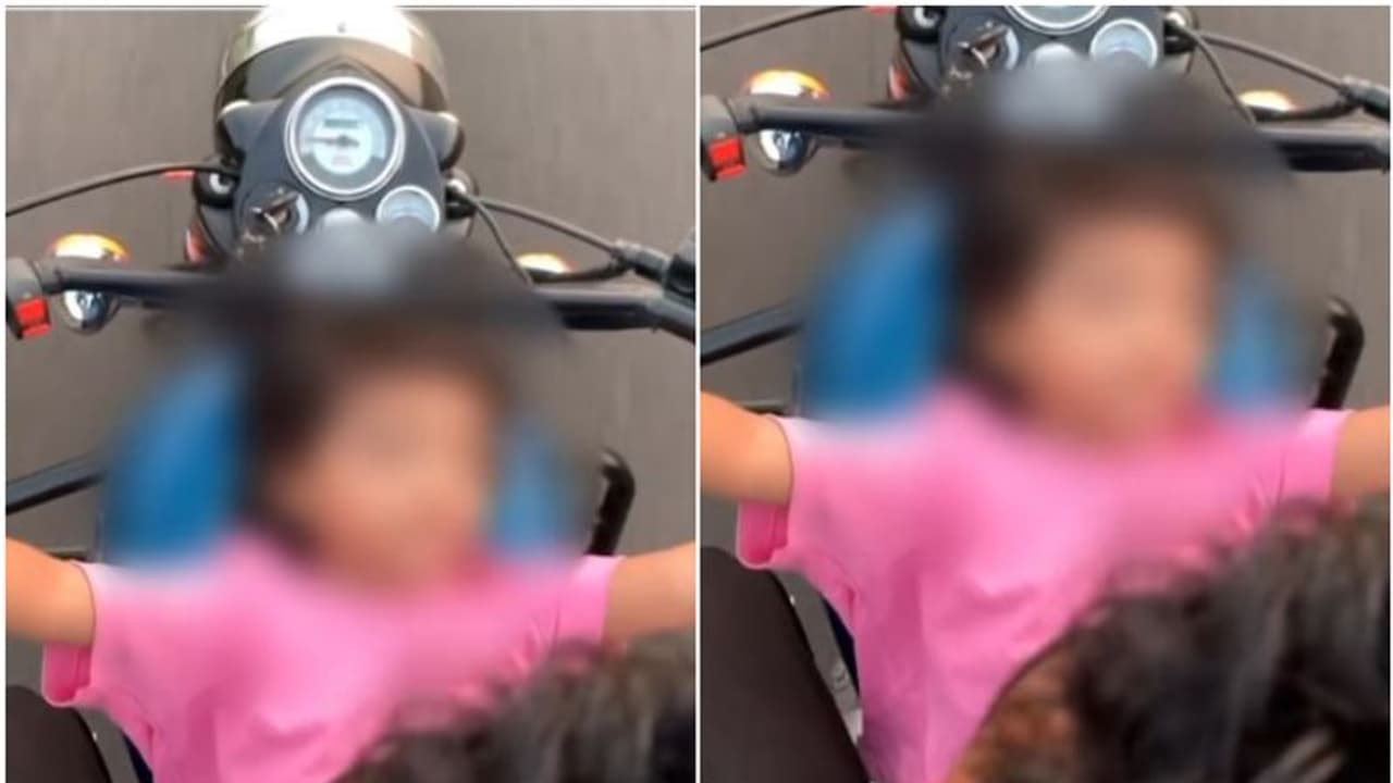 ചീറി പായുന്ന ബുള്ളറ്റിന്‍റെ ടാങ്കിൽ കുഞ്ഞിനെ കിടത്തി യാത്ര! വീഡിയോയുമായി പൊലീസ്; 'സ്നേഹമല്ല, അപകടകരമായ കുറ്റം'