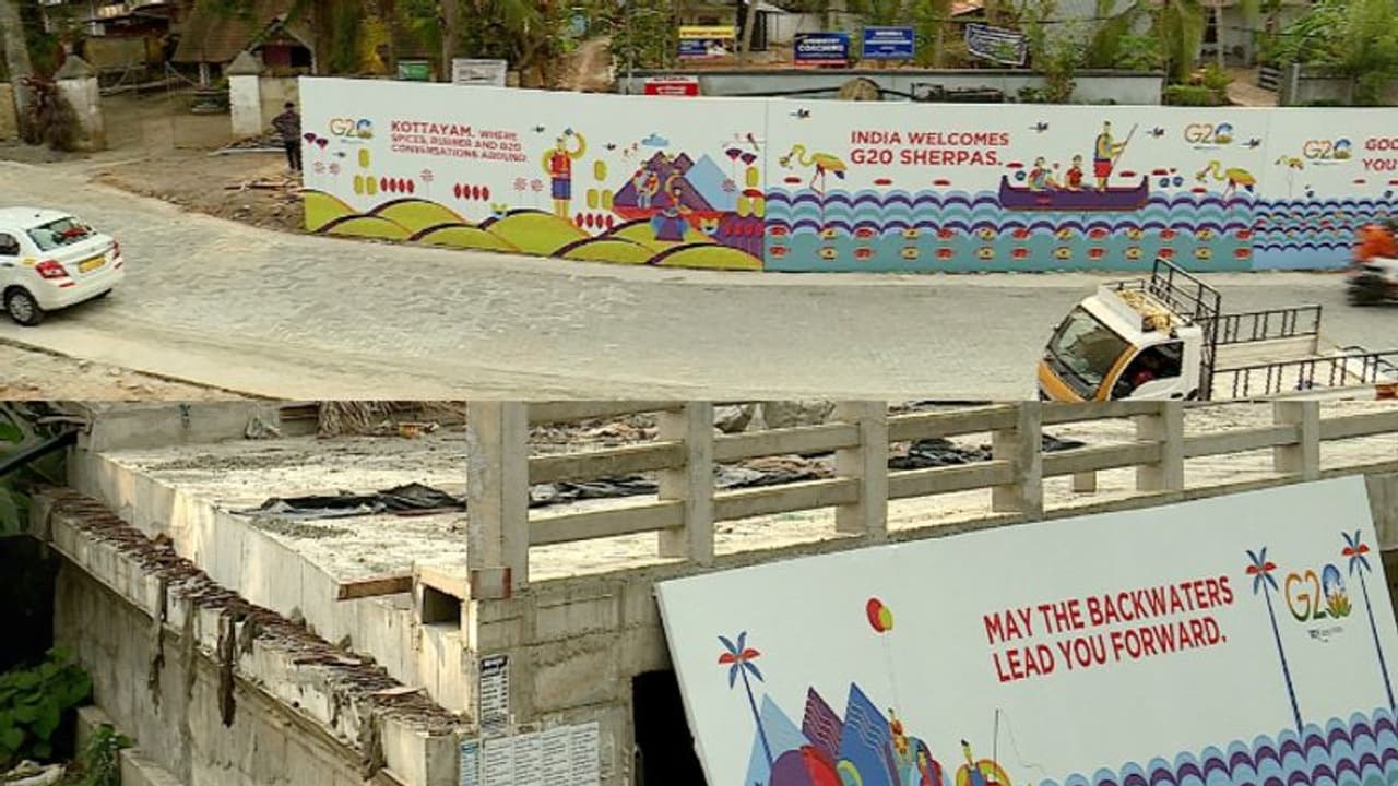 'വിദേശ പ്രതിനിധികൾ കണ്ടാൽ നാണക്കേടല്ലേ..', കോട്ടയത്തെ വര്‍ഷങ്ങളായി പണിനിലച്ച പാലം മറയ്ക്കാൻ ബോര്‍ഡുകൾ 