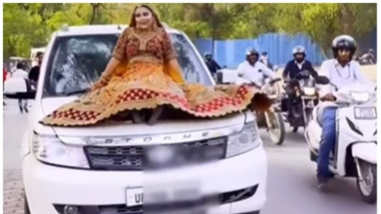 എസ്‍യുവിയുടെ ബോണറ്റില്‍ കയറി ഇരുന്ന് വിവാഹ റീല്‍ ഷൂട്ട്; വീഡിയോ വൈറല്‍, പിന്നാലെ പിഴയിട്ട് പോലീസും 