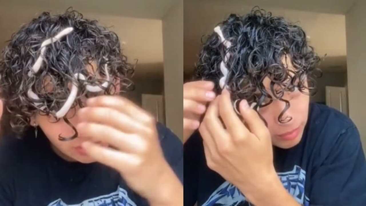 മുടിച്ചുരുളിനുള്ളില്‍ കുരുങ്ങിക്കിടക്കുന്ന പാമ്പ്; യുവാവിന്‍റെ വീഡിയോ...